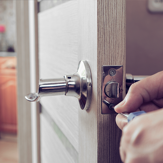 Locksmith fixing interior door lock